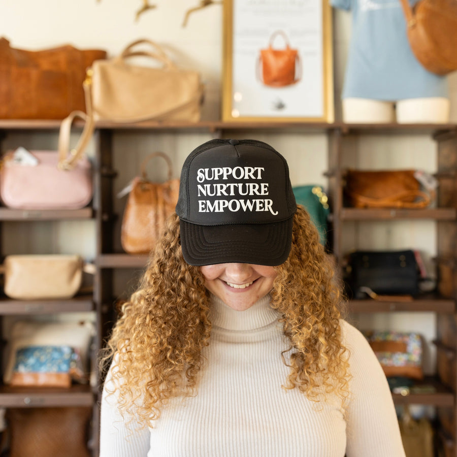 Support. Nurture. Empower. Trucker Hat