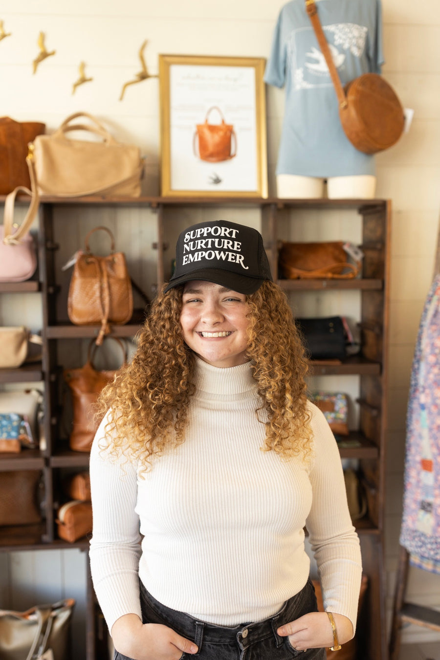 Support. Nurture. Empower. Trucker Hat